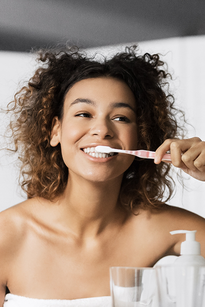 Woman brushing her teeth