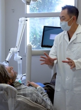 San Jose dentist talking to a patient in the treatment chair