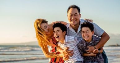 Doctor Lim with his family on a beach