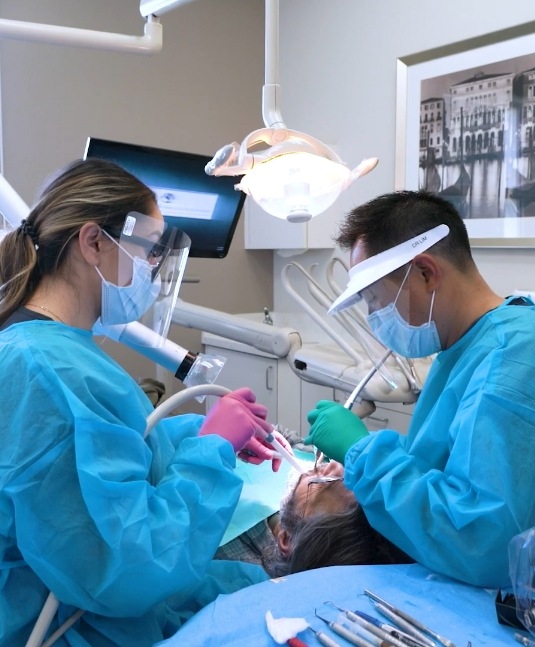 San Jose dentist and assistant treating a dental patient